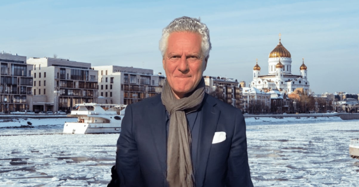 Vittorio Assaf, co-founder of Serafina Restaurant Group, standing at a New York City event. He is dressed in a smart suit and smiling, with a backdrop of city lights.