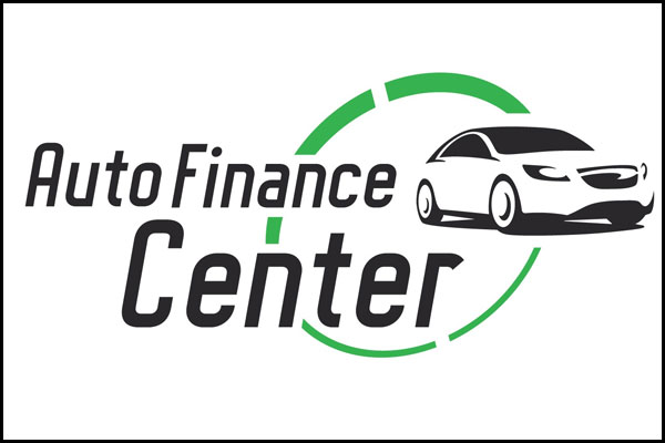 Customer and financial advisor discussing loan options inside the Auto Finance Center.